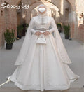 Robe de Mariée Caucasienne – Manches Longues Brodées Ivoire